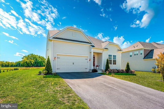 view of front of house with aphalt driveway, an attached garage, and a front lawn