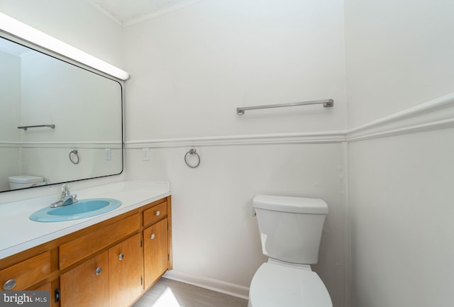 bathroom featuring toilet and vanity