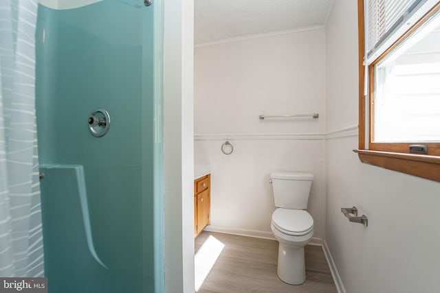 full bath featuring a shower, toilet, vanity, a textured ceiling, and wood finished floors