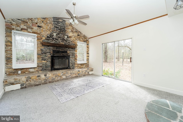 unfurnished living room featuring baseboards, ceiling fan, carpet flooring, a stone fireplace, and high vaulted ceiling