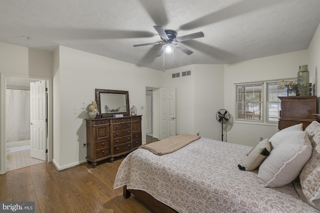 bedroom featuring visible vents, baseboards, a ceiling fan, wood-type flooring, and a textured ceiling