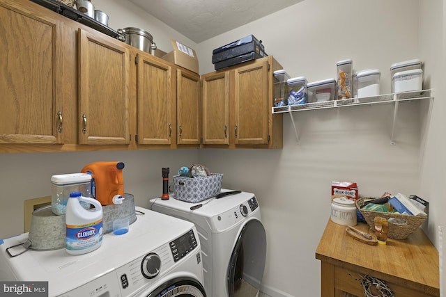 laundry area featuring cabinet space and independent washer and dryer