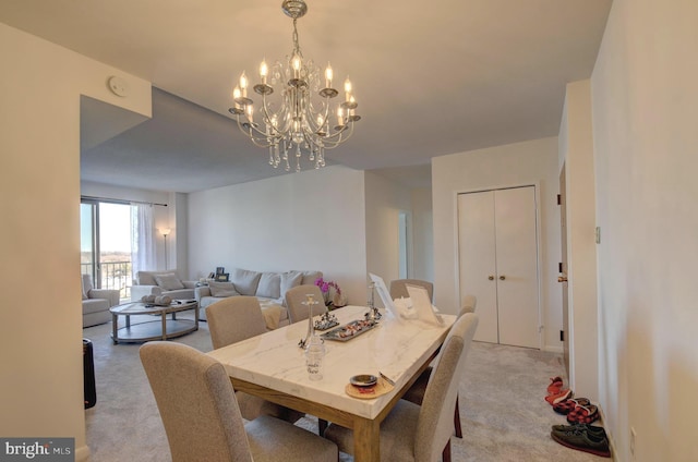 dining space featuring light carpet