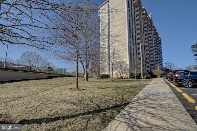 view of building exterior featuring uncovered parking