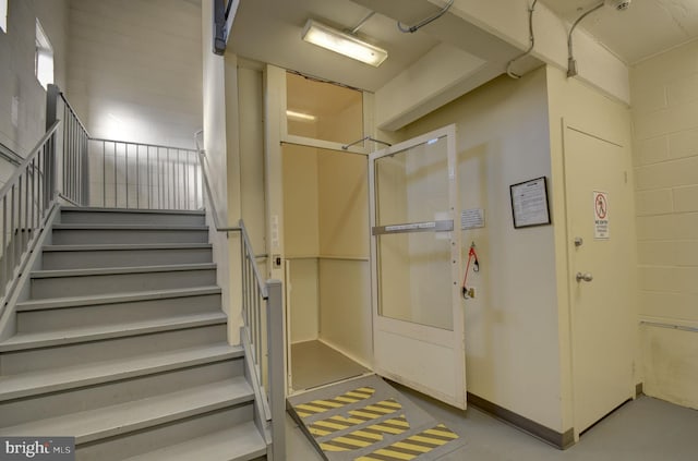 stairs with concrete floors