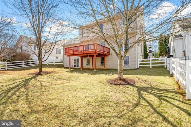 view of yard with a wooden deck and a fenced backyard