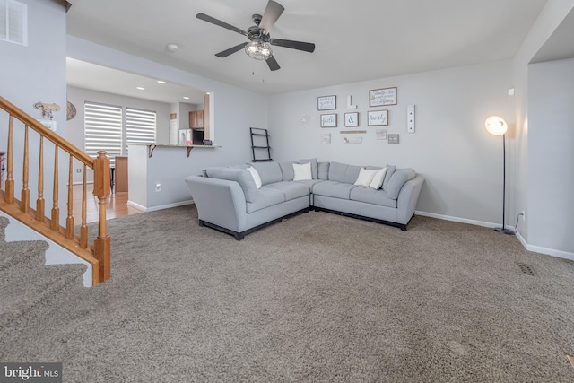 unfurnished living room featuring stairs, visible vents, baseboards, and carpet flooring