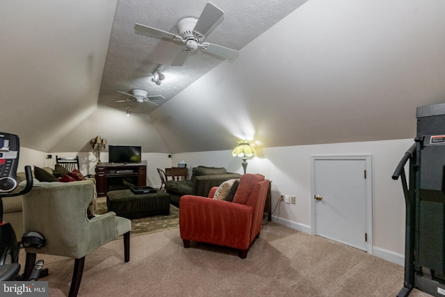 carpeted cinema room with lofted ceiling, a ceiling fan, baseboards, and a textured ceiling