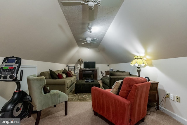 cinema featuring baseboards, ceiling fan, vaulted ceiling, a textured ceiling, and carpet flooring