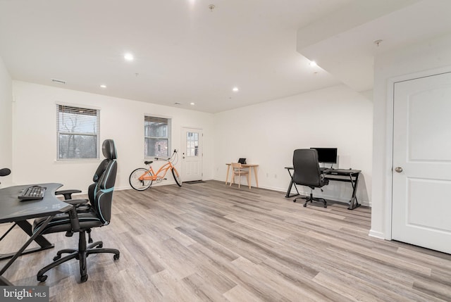 home office with light wood-type flooring, baseboards, and recessed lighting