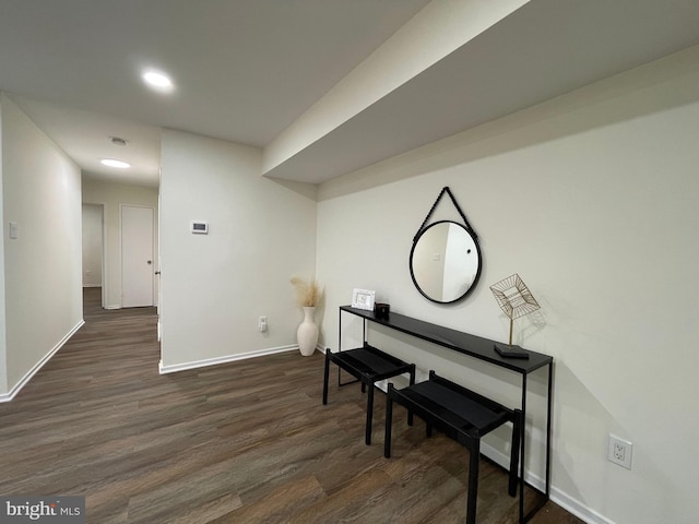 living area featuring dark wood finished floors and baseboards