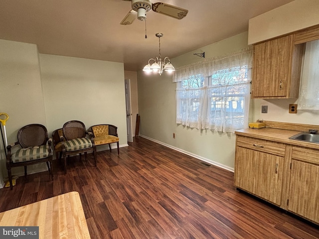 dining space featuring visible vents, baseboards, dark wood finished floors, and ceiling fan with notable chandelier