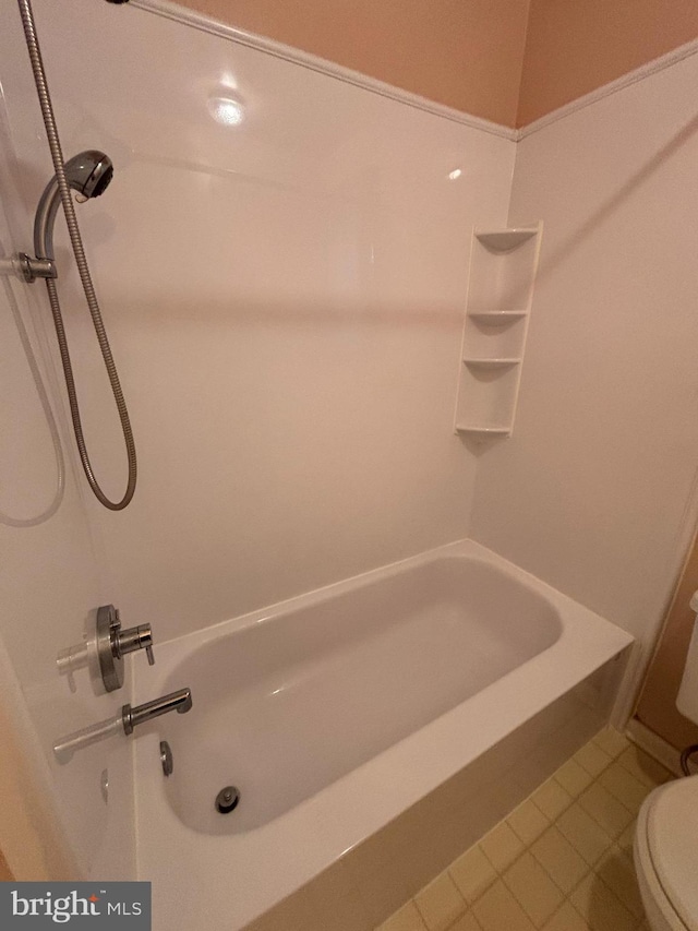 full bath with tile patterned flooring and toilet