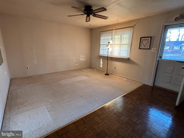 interior space with ceiling fan