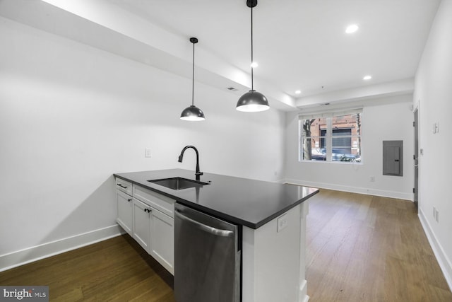 kitchen with dishwasher, dark countertops, dark wood-style flooring, a peninsula, and a sink