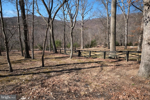 view of landscape with a forest view