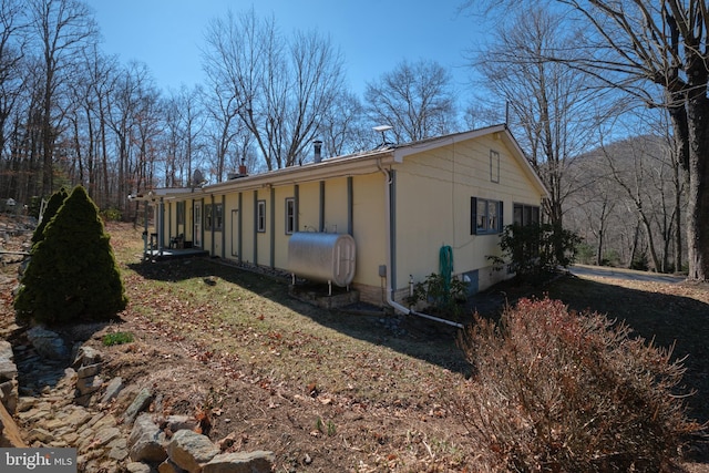 view of home's exterior with heating fuel