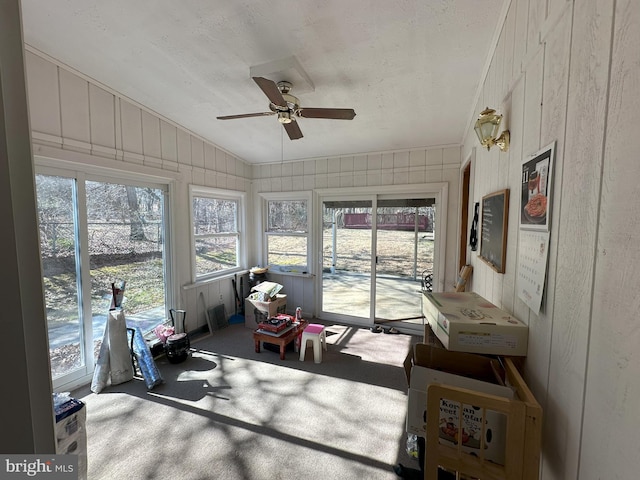 sunroom / solarium with vaulted ceiling and ceiling fan