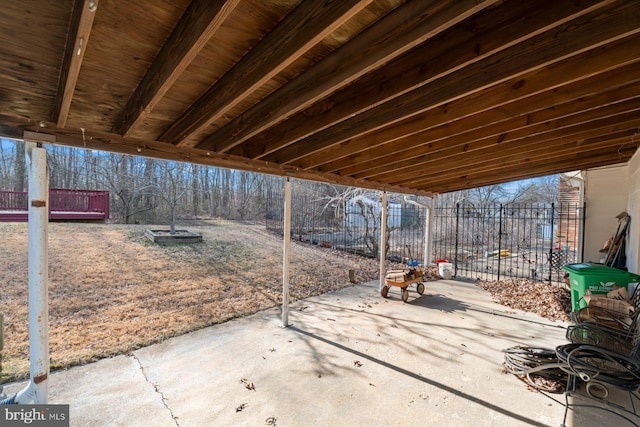 view of patio featuring fence