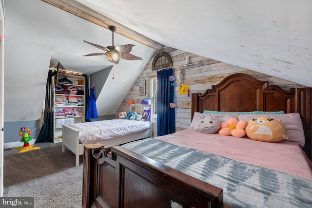 carpeted bedroom featuring vaulted ceiling with beams and a ceiling fan