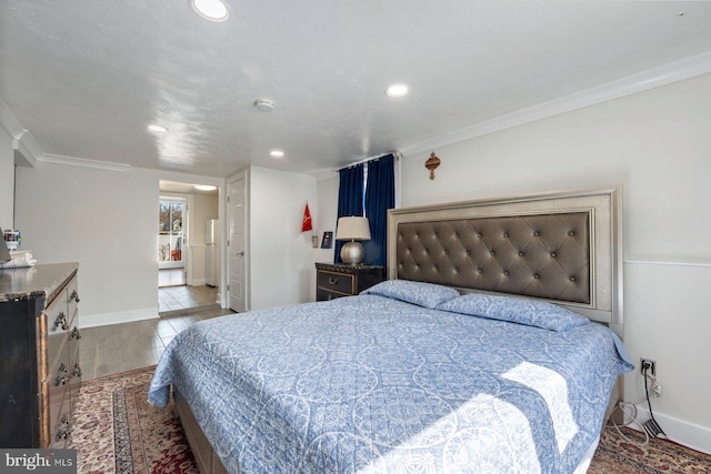 bedroom featuring recessed lighting, crown molding, baseboards, and wood finished floors