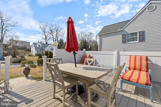 wooden terrace featuring outdoor dining area