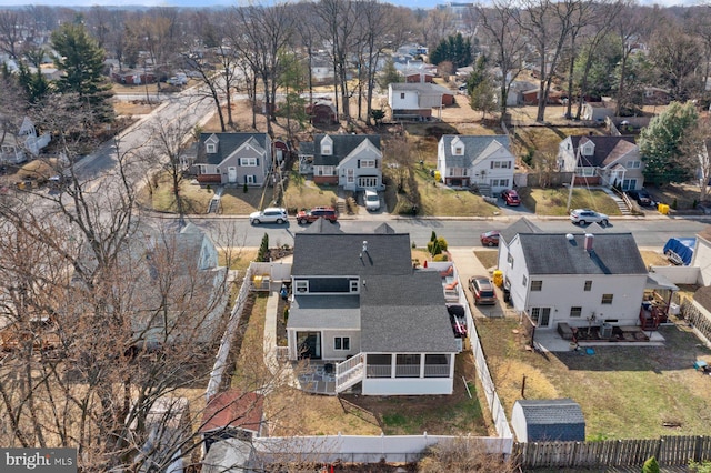 birds eye view of property with a residential view