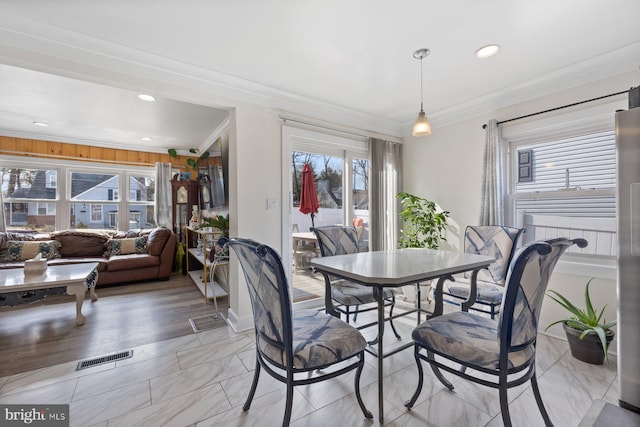 dining space with recessed lighting, visible vents, and crown molding