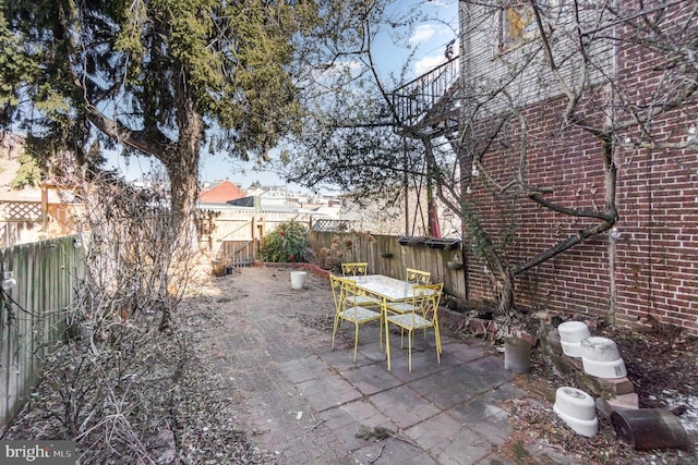 view of patio / terrace with outdoor dining space and a fenced backyard