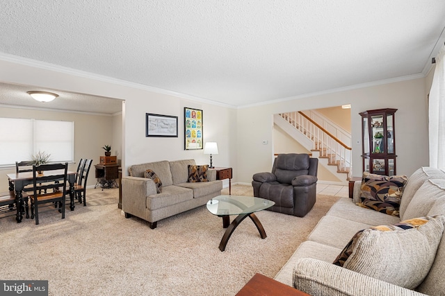 living room featuring ornamental molding, a textured ceiling, baseboards, light colored carpet, and stairs