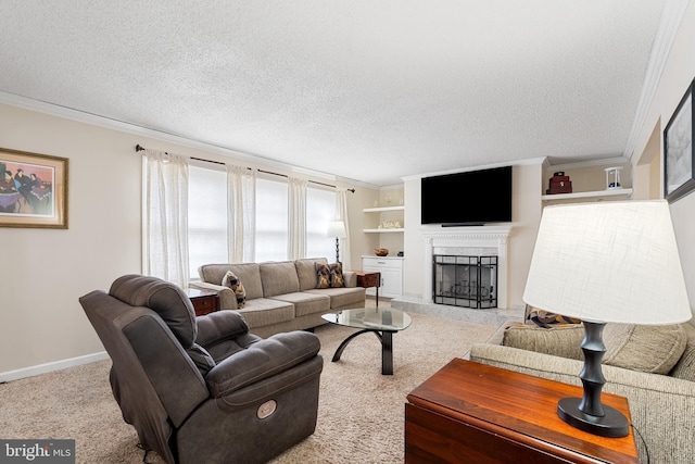 living room featuring a tiled fireplace, crown molding, carpet, and a textured ceiling