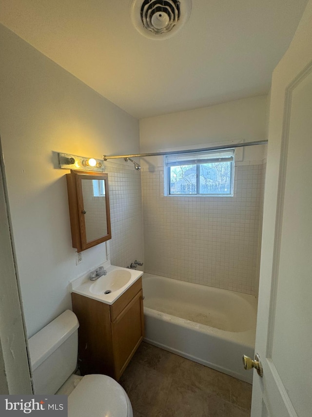 full bathroom featuring tile patterned flooring, toilet, visible vents, vanity, and tub / shower combination