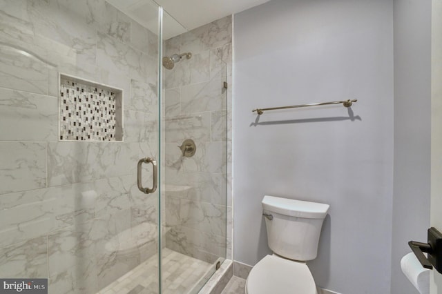 full bath with toilet and a stall shower