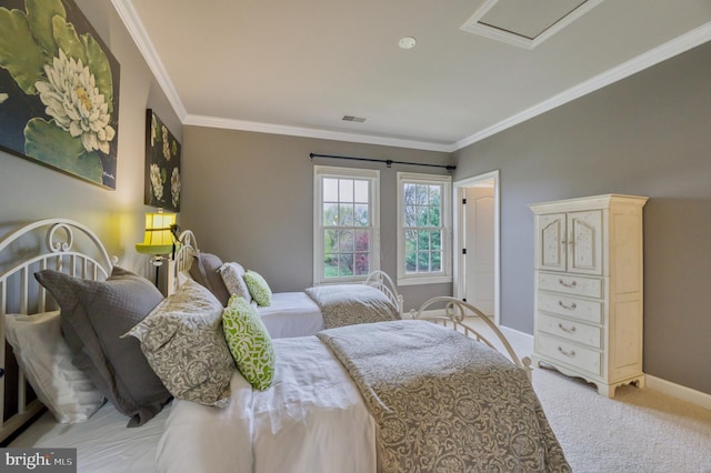 bedroom featuring carpet flooring, visible vents, baseboards, and crown molding