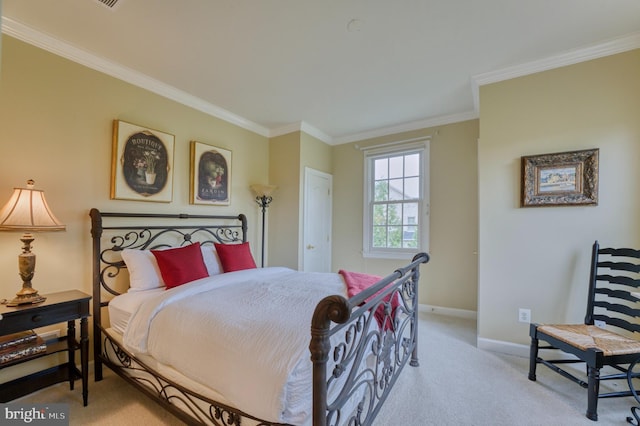 carpeted bedroom with baseboards and ornamental molding