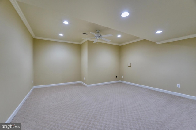 spare room with light carpet, recessed lighting, and ornamental molding