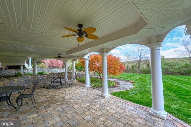 view of patio / terrace featuring outdoor dining space and a ceiling fan
