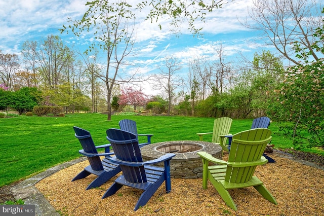 view of yard with an outdoor fire pit