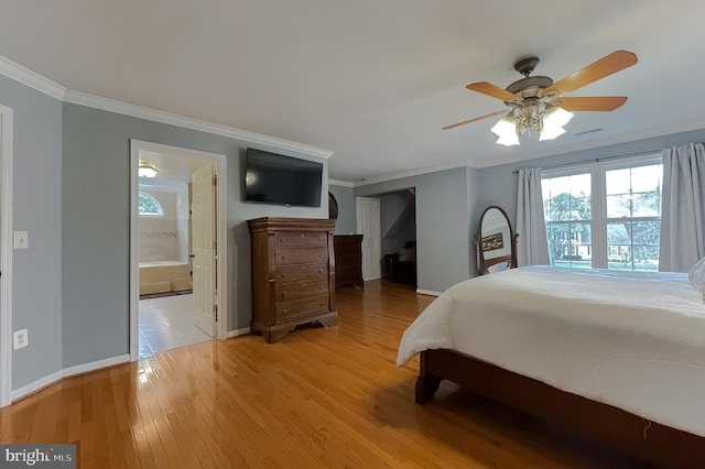 bedroom featuring baseboards, light wood-type flooring, connected bathroom, and crown molding