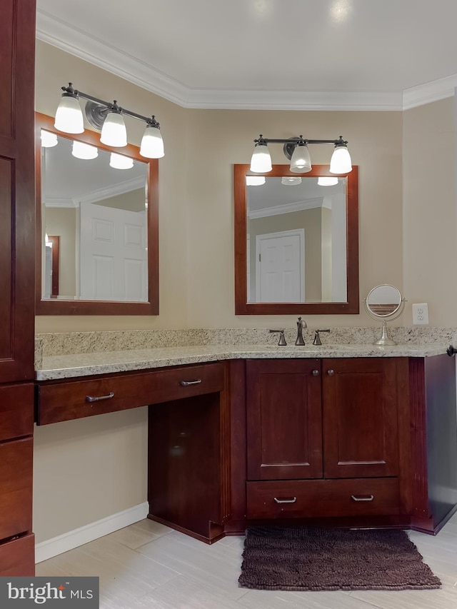 bathroom featuring crown molding and vanity