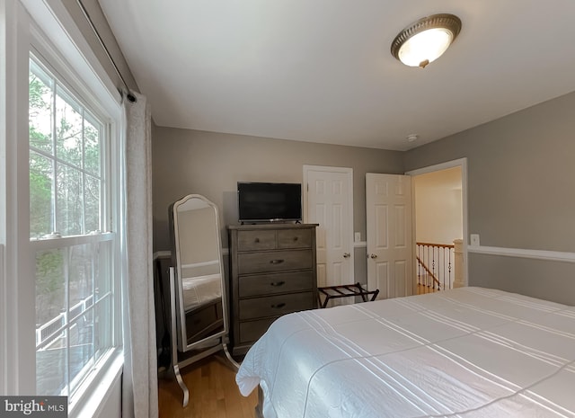 bedroom featuring wood finished floors