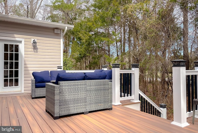 wooden deck with outdoor lounge area