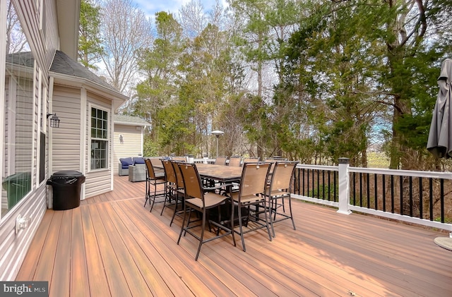 deck with outdoor dining space