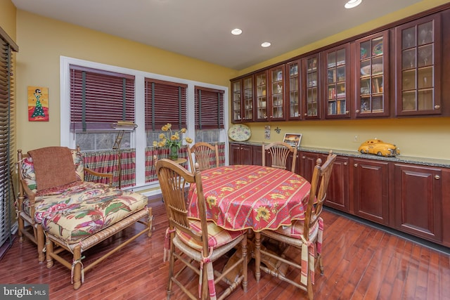 dining area with dark wood-style floors and recessed lighting