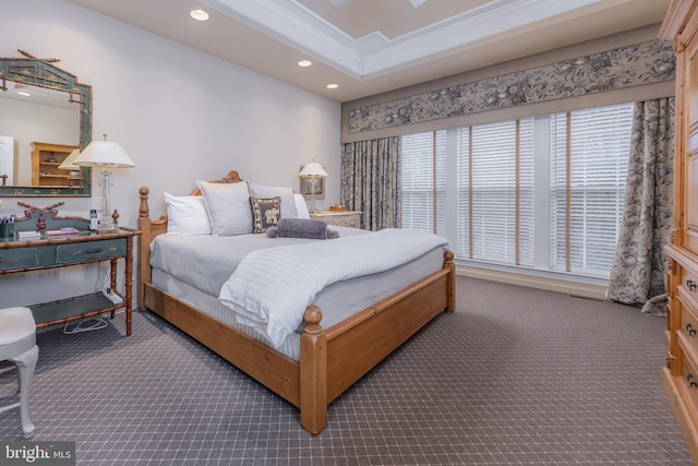 carpeted bedroom with ornamental molding, a raised ceiling, and recessed lighting