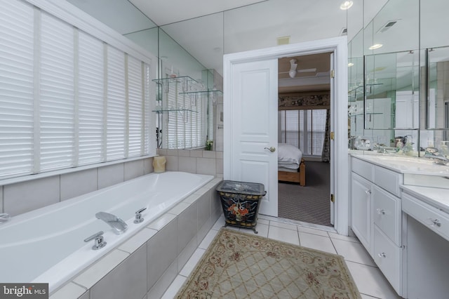 full bath featuring a garden tub, tile patterned flooring, vanity, visible vents, and ensuite bath