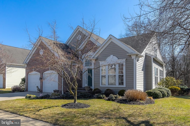 view of front of property with an attached garage, driveway, and a front yard