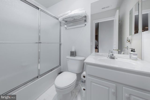 bathroom featuring visible vents, shower / bath combination with glass door, vanity, and toilet