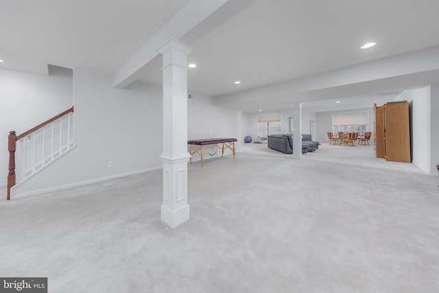 finished basement featuring recessed lighting, baseboards, stairway, and carpet