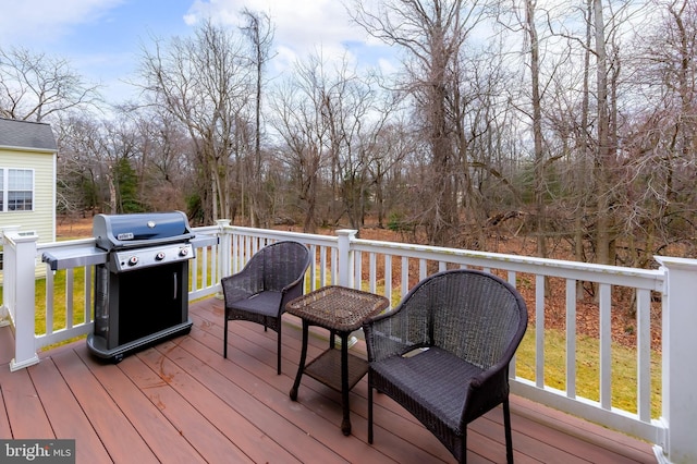 wooden deck with grilling area